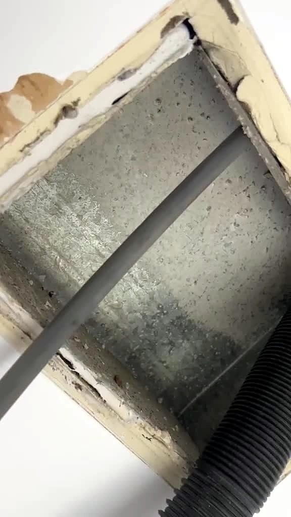 Brush cable and vacuum hose working in a register boot