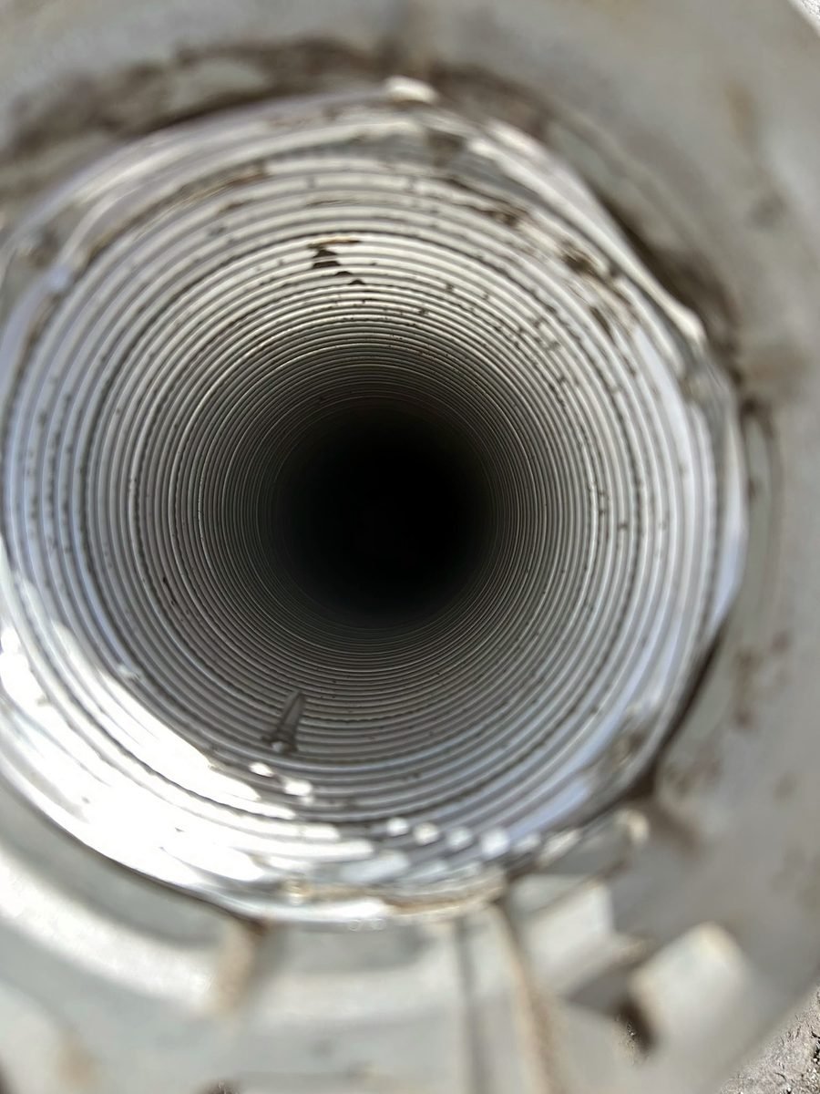 Clean round metal dryer vent duct after lint removal