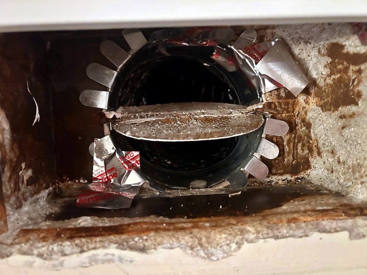 Register boot with stains, old tape and a dusty damper